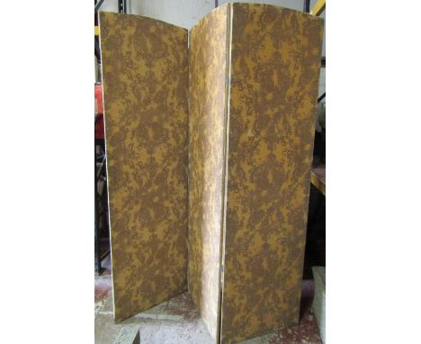 A large floorstanding threefold screen/room divider with upholstered panels with repeating foliate pattern 246 cm high, each 