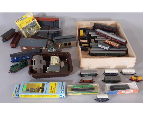 Collection of N gauge railway coaches, rolling stock and buildings including coaches by Fleischmann, Arnold, Minitrix and Atl