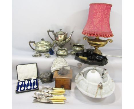 A miscellaneous collection of items including loose bone handle flatware, a silver plated four piece tea service, a wooden co