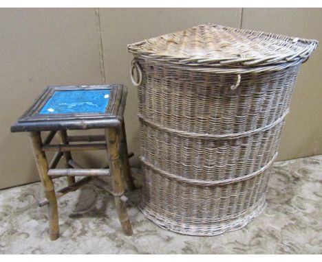 A Victorian bamboo stool on swept supports the top with inlaid ceramic panel showing a pointer, together with a vintage wicke