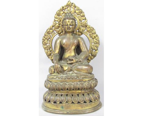 A Sino-Tibetan bronze figure of buddha depicted seated in the dhyanasana position on a lotus base of two sections, 24 cm high