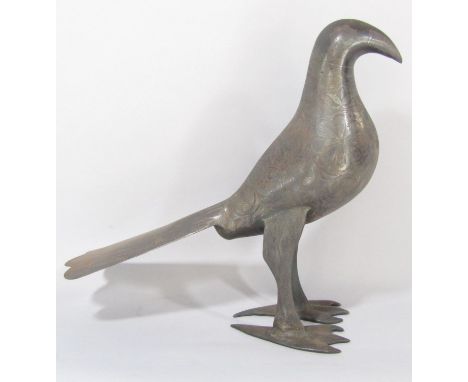A bronze middle Eastern/Persian wading bird naively cast with intricate incised flowers and tail feathers 32 cm high 