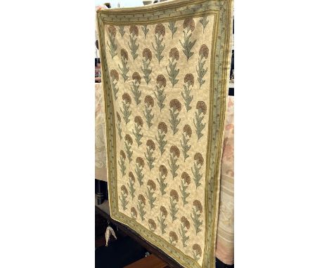 A Kashmiri hand chain stitched wool tapestry with an all over single flower patterned on a circular stitched ground, 173cm x 