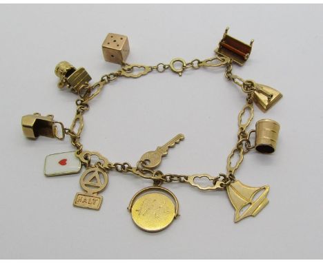 9ct charm bracelet hung with a selection of charms to include 'Halt' road sign, 'I Love You' spinner, enamelled playing card,