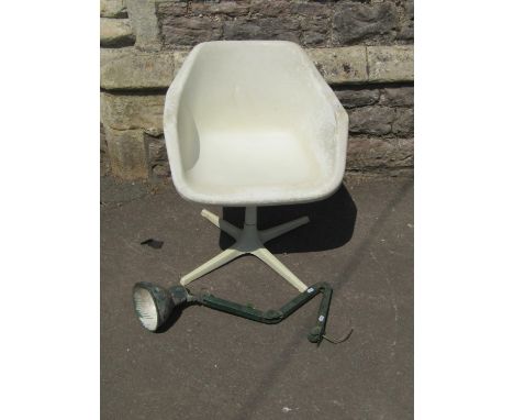 An industrial anglepoise lamp in green, together with a further vintage office chair on swivel seat with turned pillar and tr