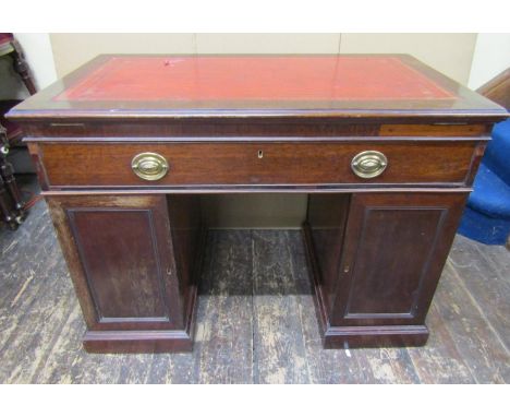 A Georgian mahogany architects desk with rising and adjustable top, maroon coloured leather inset, over a frieze drawer, baiz