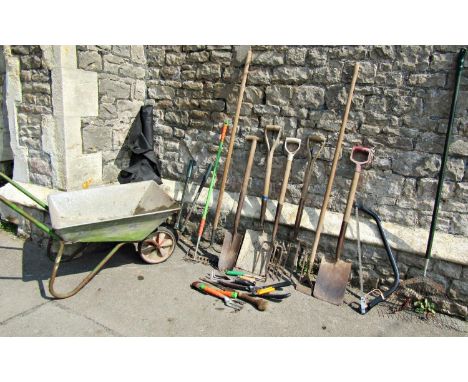 A small wheelbarrow with galvanised body together with a collection of hand tools 