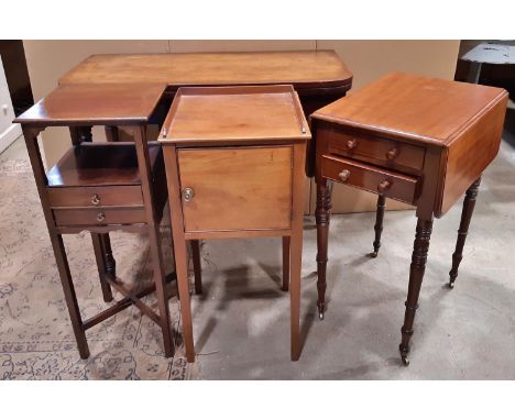 An early 19th century mahogany fold over top tea table raised on ring turned and tapered supports 90 cm wide together with a 
