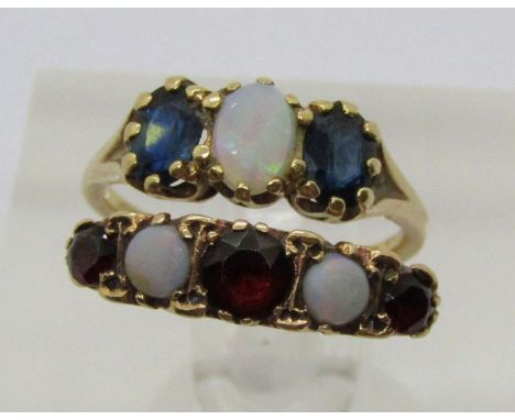 Two 9ct opal rings; a three stone sapphire example and a five stone garnet example, 4.8g total 