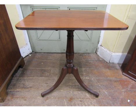 A Georgian mahogany rectangular snap top table, with tapering gun barrel pillar and reeded tripod base, 60cm 