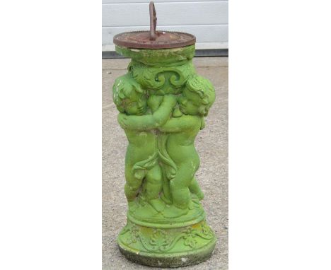 A light green painted cast composition stone cherub pedestal supporting a circular cast iron sun dial 62 cm high 
