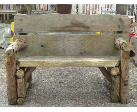 A rustic wooden garden bench with plank seat, 145 cm wide 