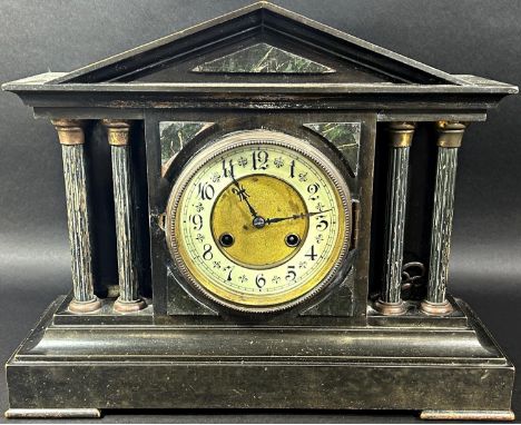 A Victorian classical mantle clock in simulated black slate and marble, with eight day striking movement 