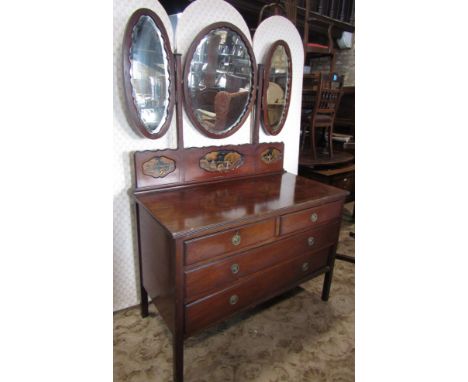 An Edwardian mahogany and chinoiserie bedroom suite comprising wardrobe with central mirror panelled door, dressing chest of 