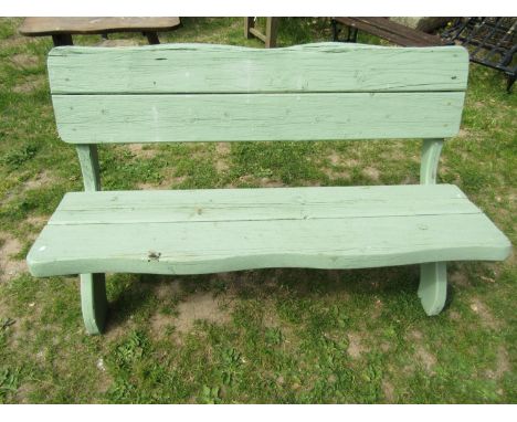 A light green painted rustic wooden bench raised on x framed supports, 140 cm wide 