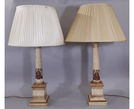 A pair of reproduction Georgian style column lamp in armorial detail on square cut base 