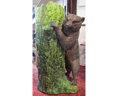 A Bretbyware stick stand modelled as a tree trunk bear cub, naturalistic painted finish 