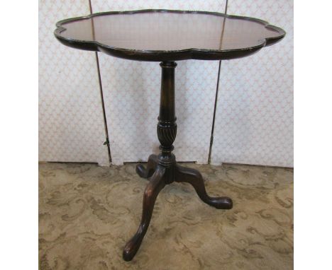 A Georgian style supper table with shaped outline on turned pillar and tripod, together with an Edwardian circular mahogany o