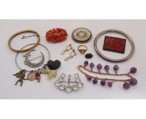 Collection of antique and later costume jewellery to include three bangles, coral bead brooch, gilt metal bracelet with ameth