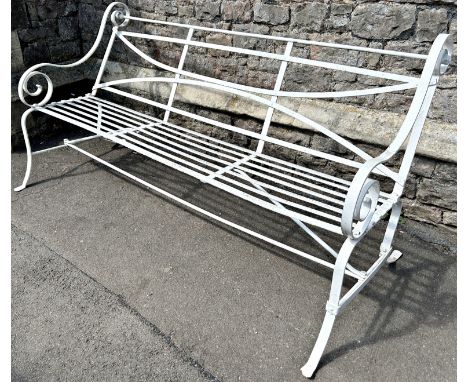 A heavy gage regency style strapwork garden bench with open scrolled arms. 185cm W