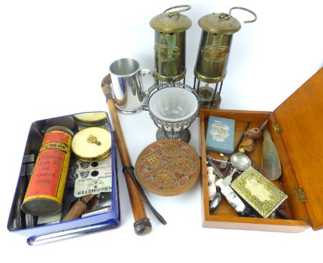 Various collectibles to include two reproduction miners' lamps, a bamboo elephant whip, a butter press, corkscrew, shoehorn, 