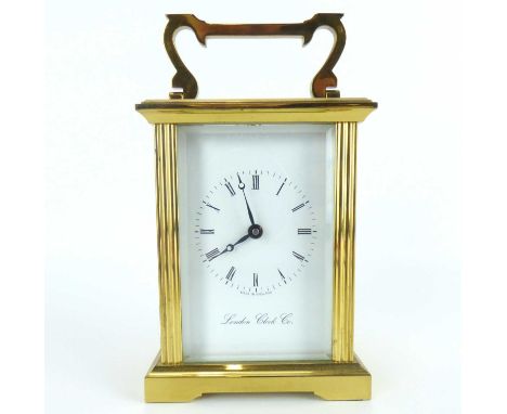 LONDON CLOCK COMPANY; a brass carriage clock, the white enamelled dial set with Roman numerals, glass sides, back and top and