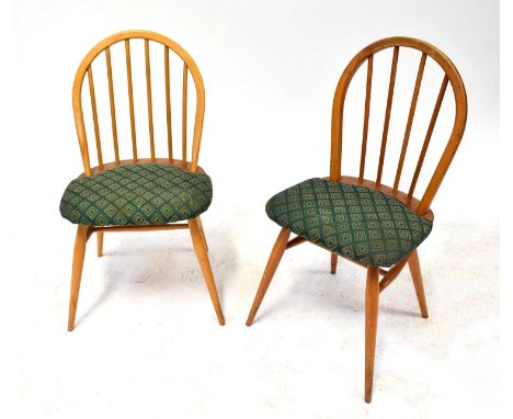 ERCOL; a set of four stick back Windsor chairs with padded seats (4).Qty: 4