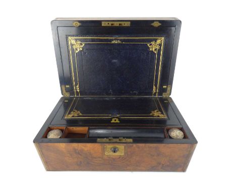 A 19th century burr walnut veneered writing slope with brass inset border and central square blank panel, the interior with g