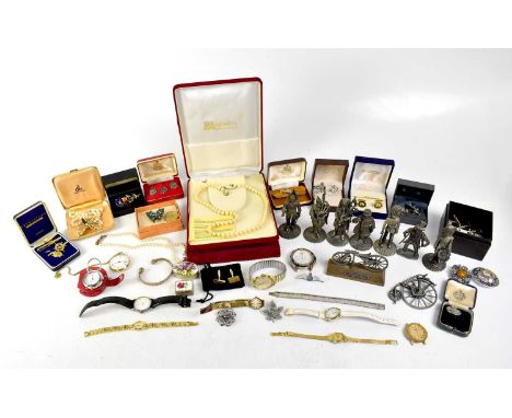 A quantity of costume jewellery to include diamanté brooches, Celtic-style brooches, cufflinks, a commemorative silver Monet 