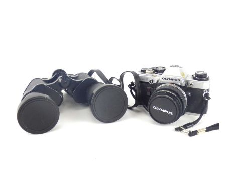 An Olympus OM10 camera and case, together with a pair of Cartex Zenith Triple Tested 10x50 field binoculars in case (2).Qty: 