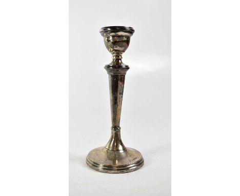 A George V hallmarked silver column candlestick to stepped circular base, maker's mark rubbed, Birmingham 1925, height 20cm, 