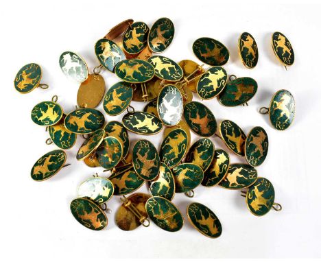 Fifty gilt metal and green enamel unicorn badges (50).Qty: 50