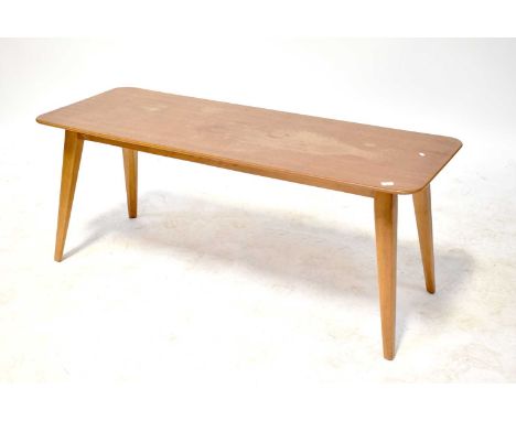 VANSON; a 1960s teak coffee table with shaped top above outswept tapering supports, 43 x 107 x 40cm (af).43 x 107 x 40cmThe t