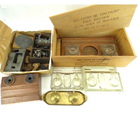 Various early 20th century desk inkwells to include a double inkwell on an oval brass tray, two inkwells on oak bases with pe