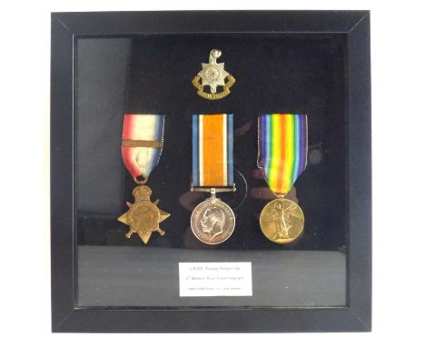 ROYAL SUSSEX REGIMENT; a WWI framed display of Victory, War and 1914 Mons Star and cap badge, awarded to Private Robert Hill 