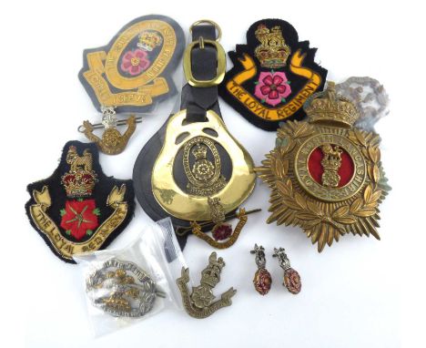 A quantity of Lancashire Regiment items to include Loyal North Lancashire officer's helmet plate, cloth badges, cap badges, s