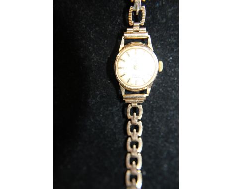 A Vintage ladies cocktail watch with a 9ct  gold body and strap gross weight 12.79 grams 