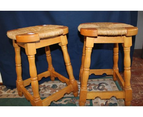 A pair of vintage pine and wicker work stools. Postage unavailable 