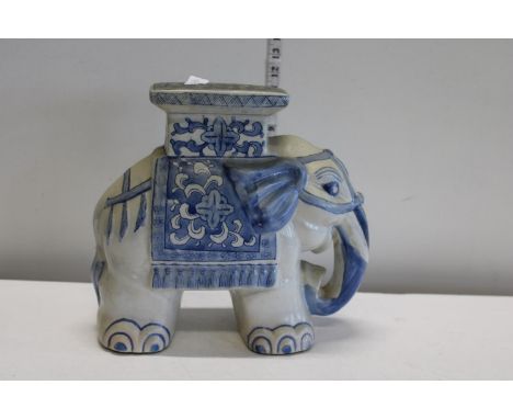 A ceramic elephant plant stand 