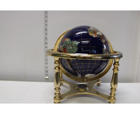 A brass and gemstone globe 