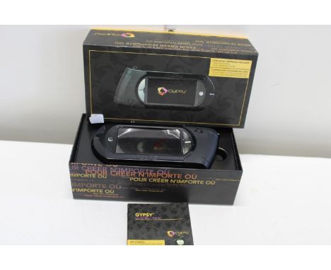 A boxed Gypsy design electronic item 
