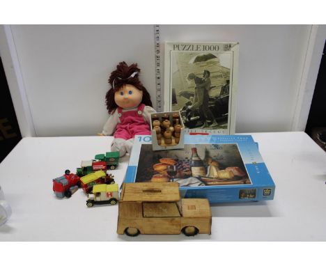 Three jigsaw puzzles and a selection of vintage toys 