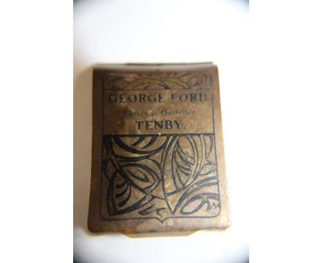 A vintage brass matchbook holder 