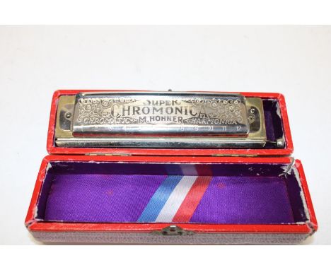 A boxed super chromonic harmonica 