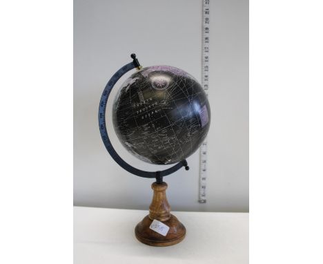 A world globe on a wooden base 