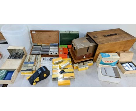 A mixed lot to include a vintage projector, The Hawk Mk V in case, along with mixed frames, slides, and other items to includ