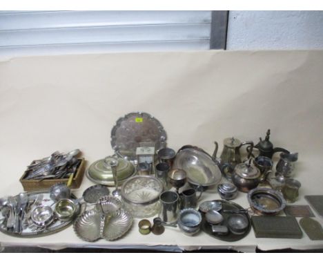 A selection of white metal and silver plated items to include a wine coaster, mixed cutlery, Austrian pottery and silver plat