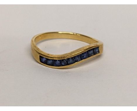An 18ct ring inset with nine sapphires, 2.5gLocation: 