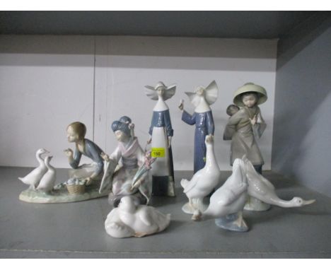 A group of Lladro and Neo porcelain figurines and animal sculptures to include two Lladro figurines of nuns, one holding a br