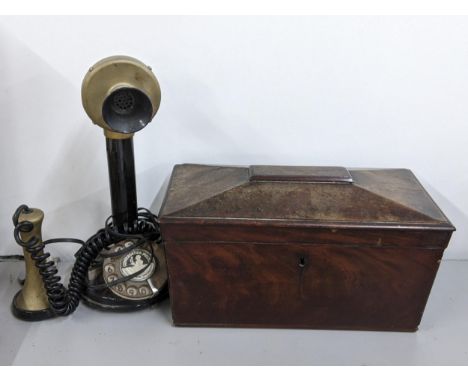 An early 19th century mahogany tea caddy together with a 'Conversation Pieces' candlestick telephone A/FLocation: 